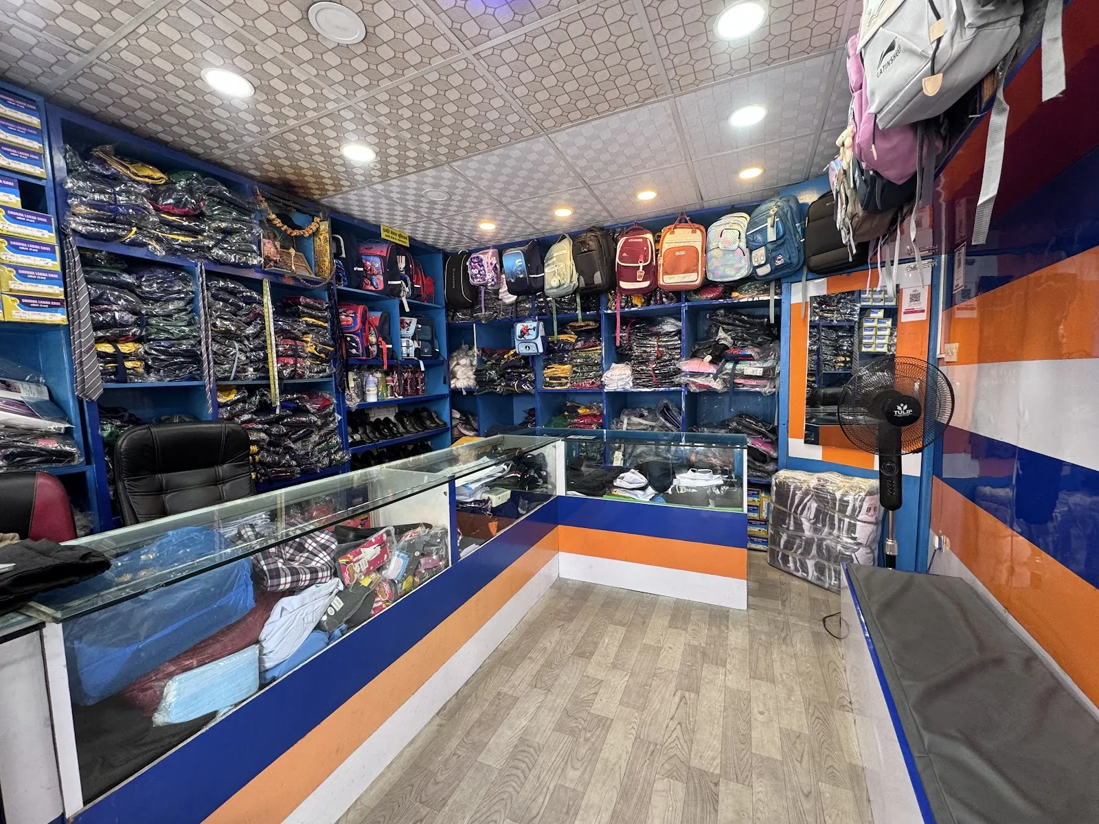 Interior of Pragati Venus Uniform with packaged uniforms, school bags and accessories on display