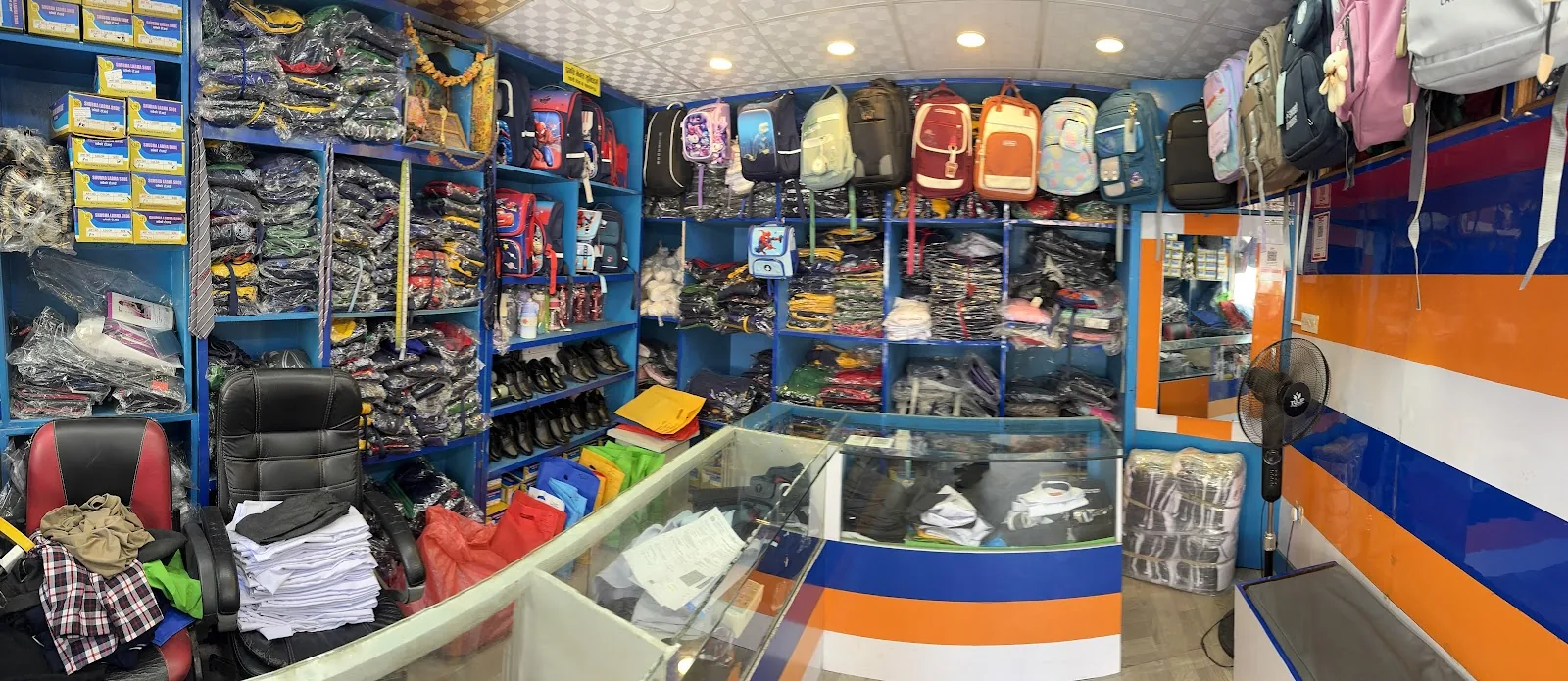 Uniforms, shoes and school bags displayed inside Pragati Venus Uniform
