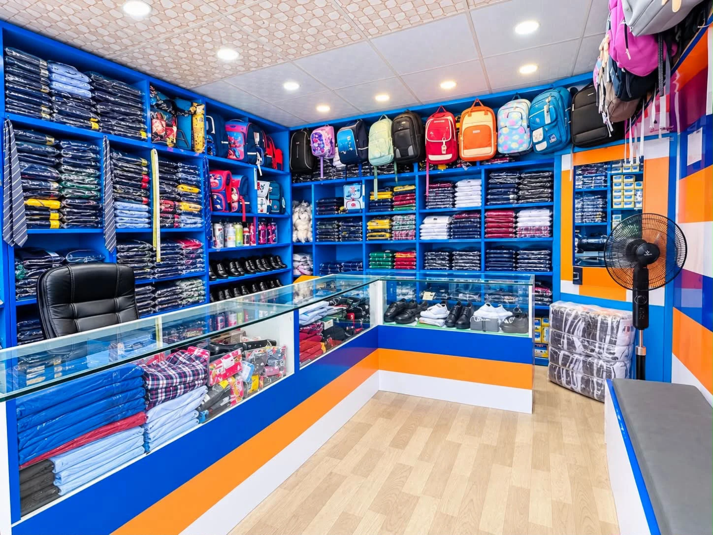 Interior of Pragati Venus Uniform with uniforms, school bags and accessories displayed on shelves